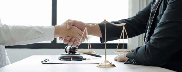 shake hand Professional man lawyers work at a law office There are scales, Scales of justice